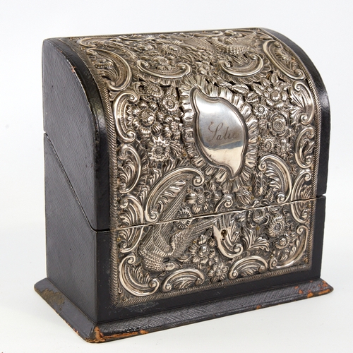 7 - An Edwardian silver mounted stationery box, curved lid with relief embossed bird and foliate decorat... 