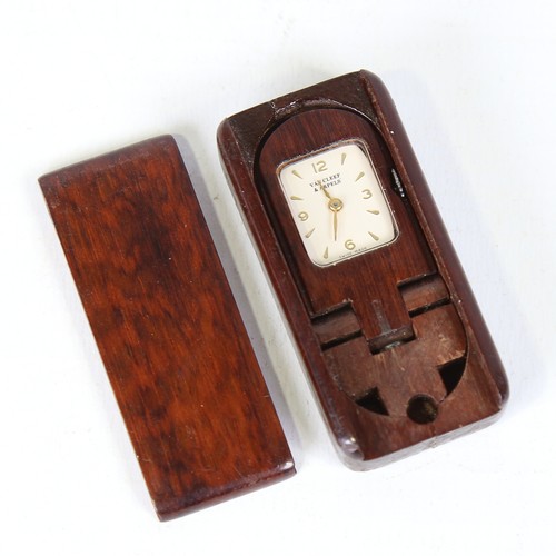 28 - VAN CLEEF AND ARPELS - a mid-20th century miniature rosewood travel clock / timepiece, silvered dial... 