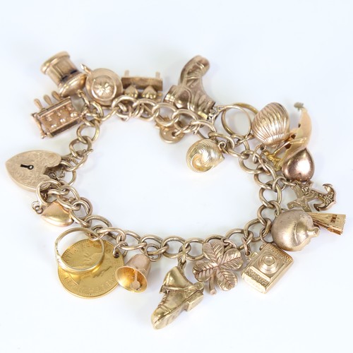 65 - A late 20th century 9ct gold curb link charm bracelet, with 20 gold charms including sixpence, bar t... 