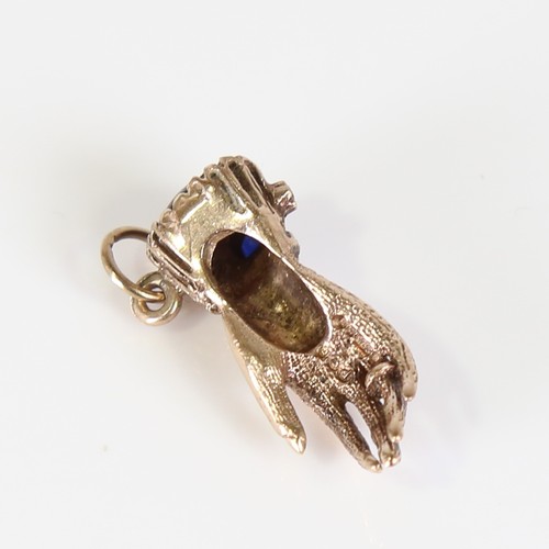 67 - A late 20th century 9ct gold gem-set figural hand charm, set with cabochon garnet, sapphires and dia... 