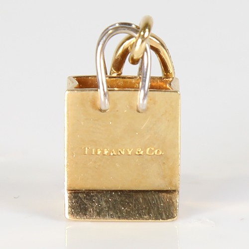 73 - TIFFANY & CO - a modern 18ct gold Gift Bag charm/pendant, with original clip fitting, overall height... 