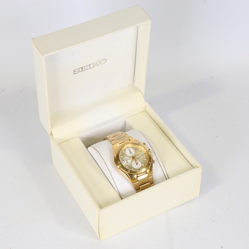 15 - SEIKO - a gold plated stainless steel quartz Chronograph wristwatch, ref. 7T92-0FX0, champagne dial ... 