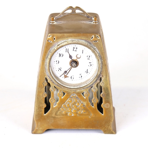 18 - A German Arts and Crafts brass-cased alarm clock, white enamel dial with Arabic numerals and pierced... 