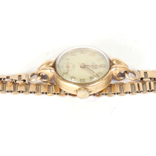 6 - A lady's Vintage 9ct gold Uno mechanical wristwatch, textured silvered dial with gilt Arabic numeral... 