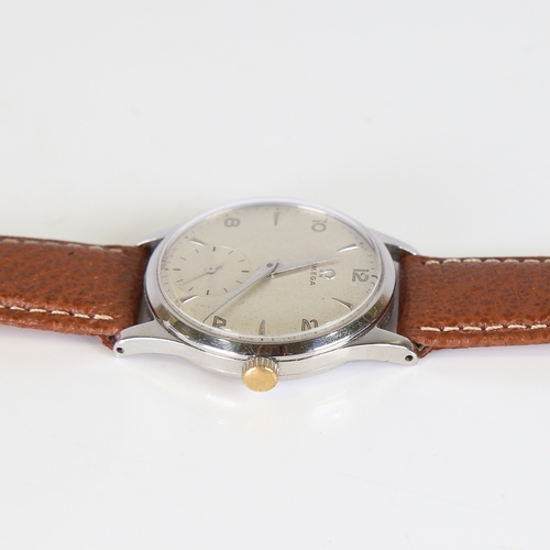 24 - OMEGA - a Vintage stainless steel mechanical wristwatch, ref. 13322, circa 1950s, silvered dial with... 