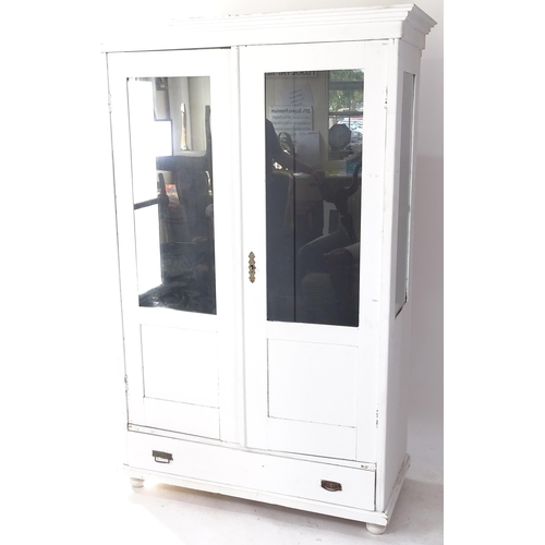2060 - A white painted pine display cabinet with 2 fixed shelves, glazed panelled doors and sides, and sing... 