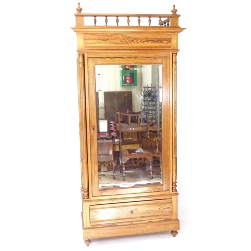 2039 - A French pitch pine armoire, with fitted shelves and single bevel-glazed door, with drawer under, co... 