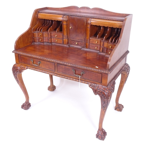 2005 - A mahogany Chippendale style writing desk with bureau fittings, having 2 frieze drawers, on cabriole... 