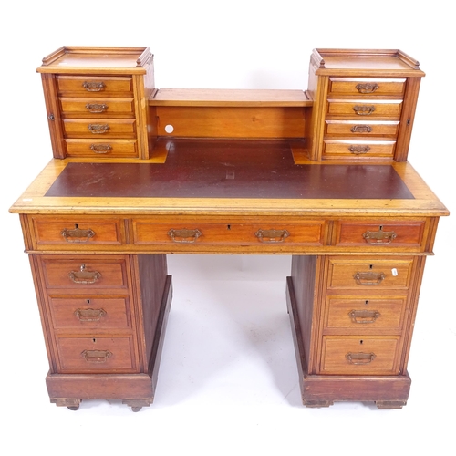 2010 - A Victorian mahogany twin-pedestal writing desk, with gallery and brown leather skiver, W122cm, H112... 