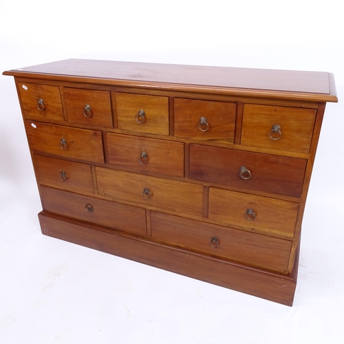 2013 - A modern mahogany chest of 13 drawers, W130cm, H85cm, D43cm