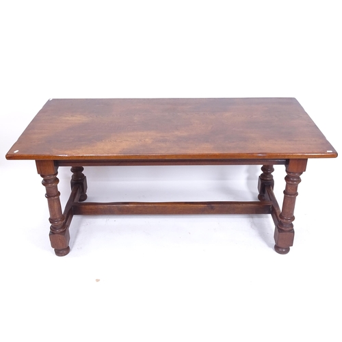 2025 - An oak refectory dining table, on turned baluster legs and bun feet, with H-shaped stretcher, L167cm... 
