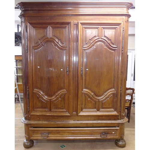 2028 - A very large and impressive 2-section fruitwood 2-door armoire, with a single frieze drawer below, w... 