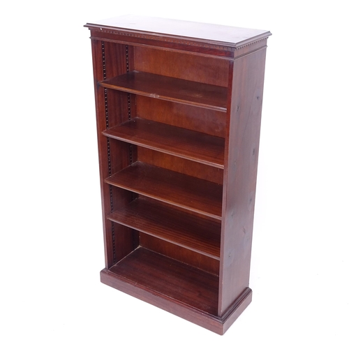2043 - A reproduction mahogany bookcase with 4 adjustable shelves, W76cm, H138cm, D31cm