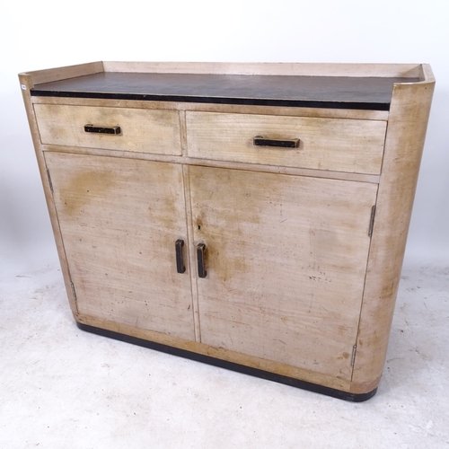 2151 - An early 20th century Heals bow-end sideboard, with 2 frieze drawers and cupboards under, with Heals... 