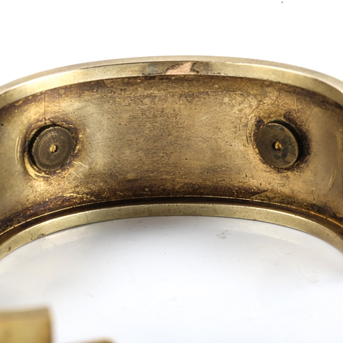 101 - A late Victorian Etruscan Revival hinged bangle, unmarked yellow metal settings, set with split pear... 