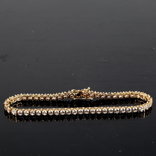 112 - A 14ct gold diamond tennis line bracelet, set with modern round brilliant-cut diamonds, total diamon... 