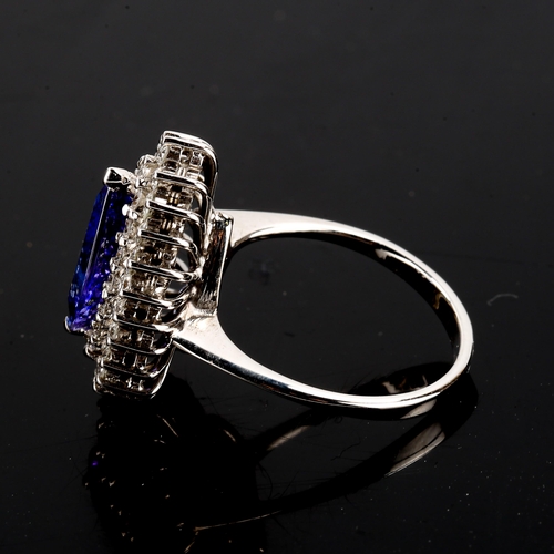134 - A large modern 18ct white gold tanzanite and diamond pear cluster ring, set with pear-cut tanzanite ... 