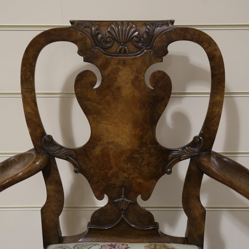 1072 - A fine 18th century walnut elbow chair in the manner of Giles Grendey, with relief carved urn-shaped... 