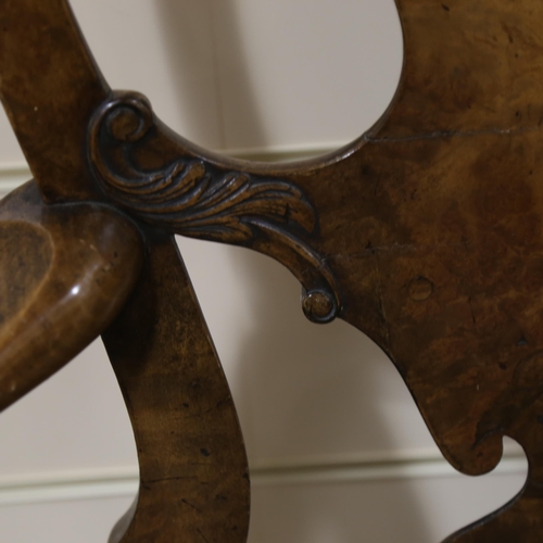 1072 - A fine 18th century walnut elbow chair in the manner of Giles Grendey, with relief carved urn-shaped... 