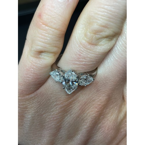 149 - A 2.5ct three stone diamond ring, central marquise brilliant-cut diamond approx 1.5ct, colour approx... 
