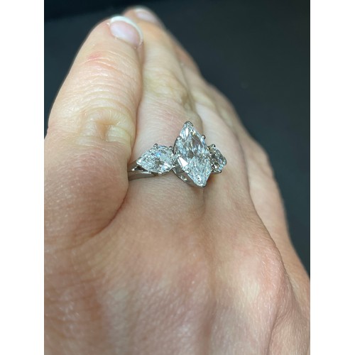 149 - A 2.5ct three stone diamond ring, central marquise brilliant-cut diamond approx 1.5ct, colour approx... 