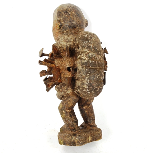 219 - An African Tribal nail fetish idol figure, nkisi nkondi (Republic of Congo), with nail hammered body... 