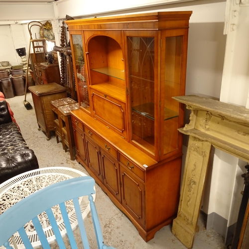 A reproduction yew wood 2section display with a dr... Barnebys