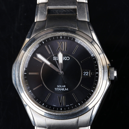 SEIKO - a titanium Solar quartz bracelet watch, ref. V145-0BA0, black ...