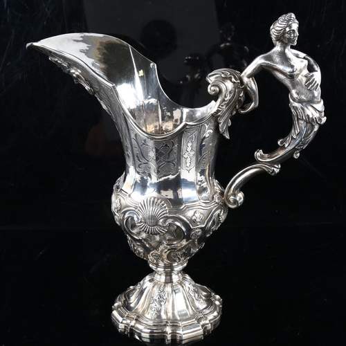 401 - A large and impressive 19th century Continental cast-silver Neo-Classical pitcher jug, possible Germ... 
