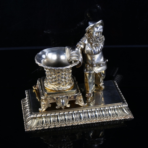 1025 - A good quality French gilt-bronze match stand/lighter, in the form of a Pierrot magician and basket,... 