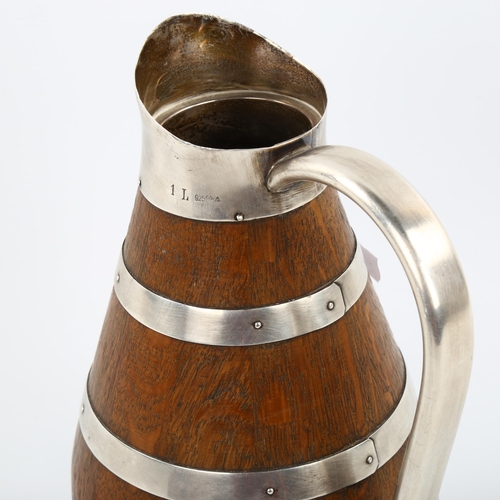 1028 - A German silver-mounted wood flagon, stamped 925, height 24cm