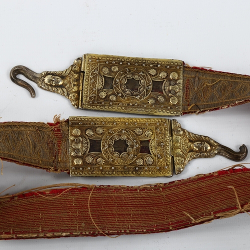 1032 - A Baltic/Russian cast silver-gilt mounted marriage belt, 17th or 18th century, with silver woven ban... 