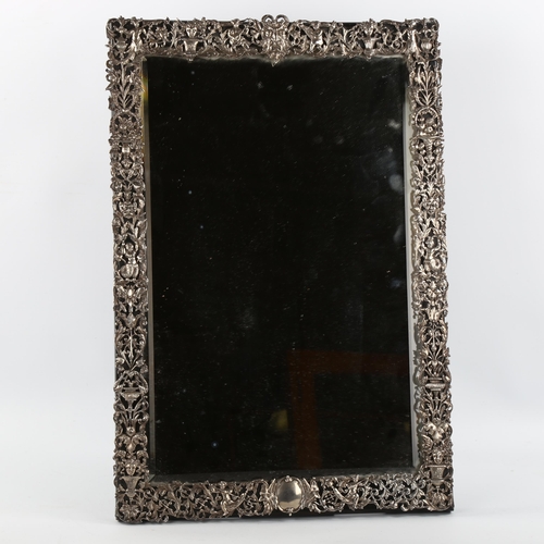 1035 - A Victorian cast silver-mounted dressing table strut mirror, on ebonised backing, hallmarks London 1... 