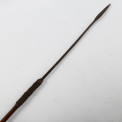 1042 - An African hunting spear with leather-bound wood handle, length 142cm