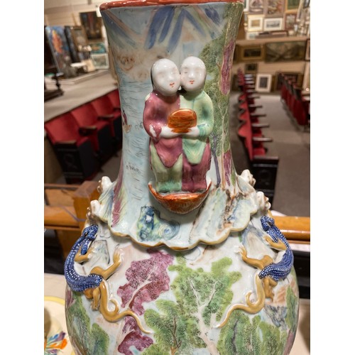 1026 - A large Chinese famille rose porcelain vase, with double-figure handles, dragon mounted neck and han... 