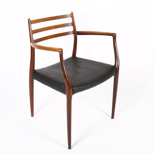 1509 - NIELS OTTO MOLLER for JL MOLLER, a Model 62 rosewood dining armchair chairs, designed 1962, with bla... 