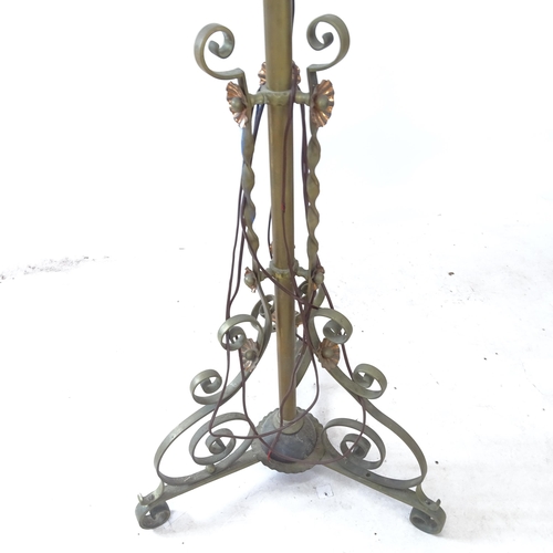 A brass telescopic standard lamp on tripod base, maximum height to ...