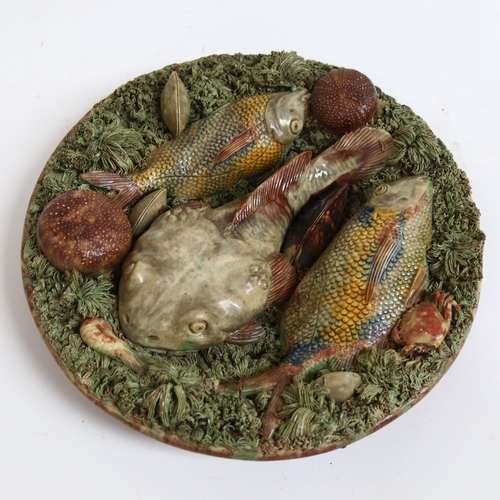 41 - A Portuguese Pallisy Majolica grotesque wall plate, monkfish and shellfish decoration, stamped verso... 