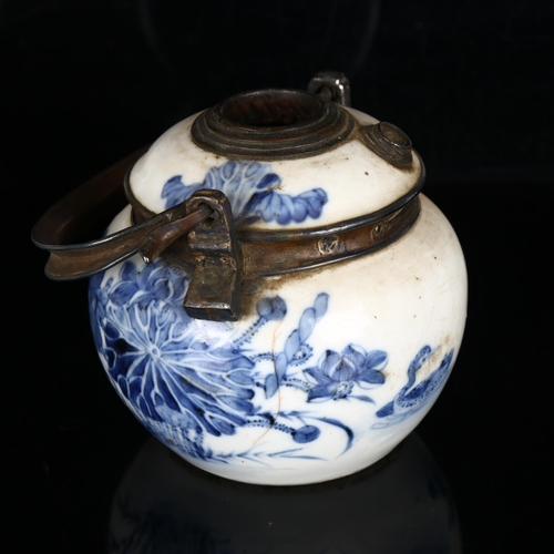 1022 - 2 Chinese blue and white opium pipe pots, with metal mounts and marks on bases, height excluding han... 