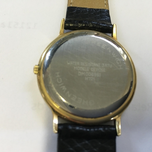 114 - Asprey of London a Ladies quartz movement watch with leather strap, model Greenwick with date apertu... 