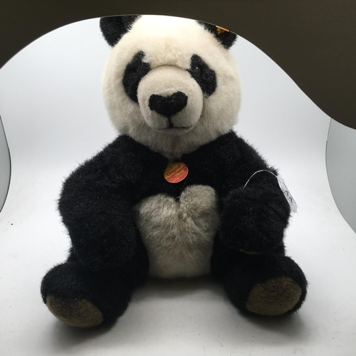 44 - Steiff Animal with original label and ear pin, Large seated Panda, 12