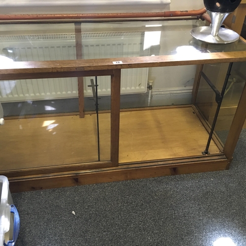 18 - Edwardian period glass shops show cabinet, oak c1920's 5'6 long 2'6 deep with single sliding glass d... 