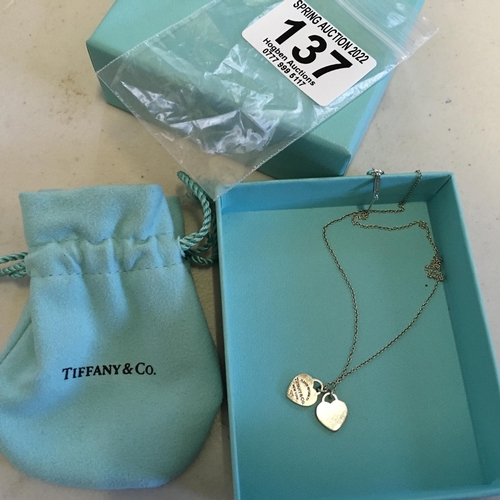 137 - Tiffany, a silver necklace with twin hearts both marked Tiffany with original packaging and keepsake... 