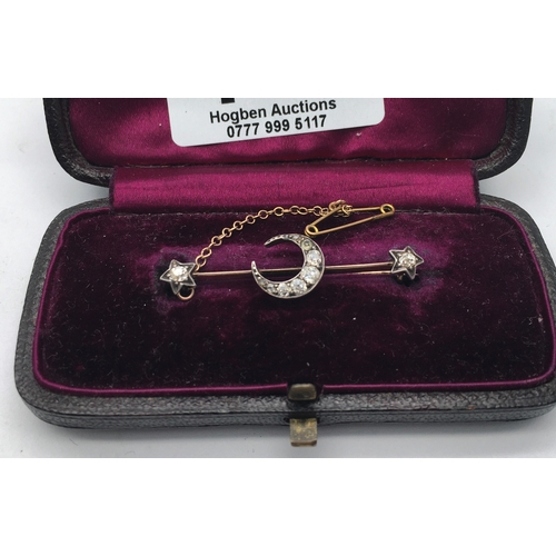 146 - Edwardian period Diamond set Horseshoe brooch, the Horseshoe set with small diamonds flanked by 2 di... 