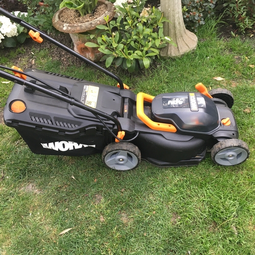 25 - Almost new used 3 time cordless electric lawn mower with 2 batteries and charger , plus grass box mo... 