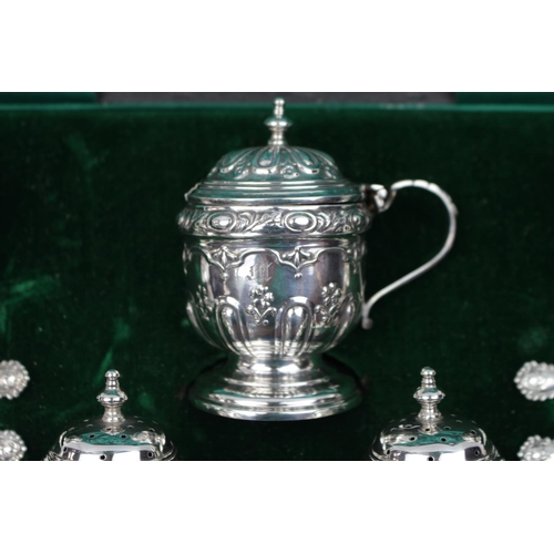 161 - George V seven piece silver cruet set by Walker & Hall Birmingham 1918, housed in a velvet and silk ... 