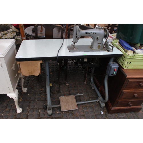 40 - Industrial Singer Sewing machine on treadle base 95K 40