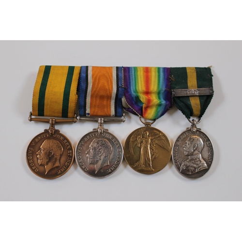 Rare Cambridgeshire Regiment group of 4 medals to corporal/Sergeant Charles Walton from Wisbech. Territorial Force Efficiency Medal. The first three are named to 4990 SGT C.J. WALTON CAMBS R and the last one to 359 Cpl C Walton 1/Cam: REGT. A Scarce group being 1 of only 34 Territorial War Medals awarded to other ranks and NCOS of this Regiment