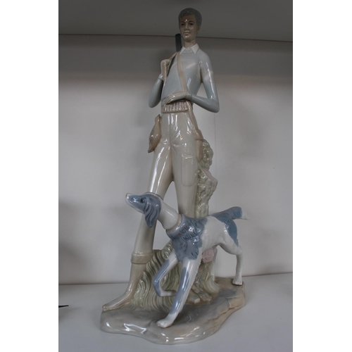 2 - Tall glazed Spanish Pottery figure of a Man with Shotgun and Gun Dog