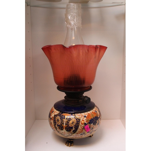 50 - Victorian Pottery based Oil Lamp with Ruby glass shade